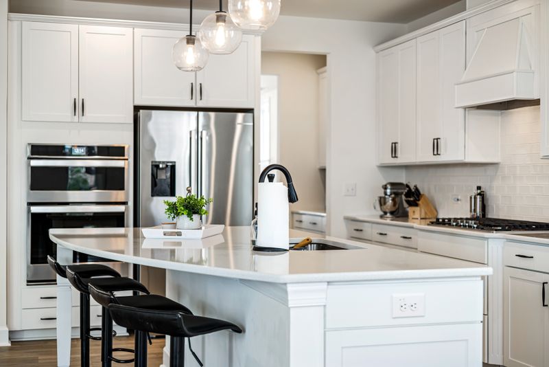 Sleek clean modern kitchen with white cabinets