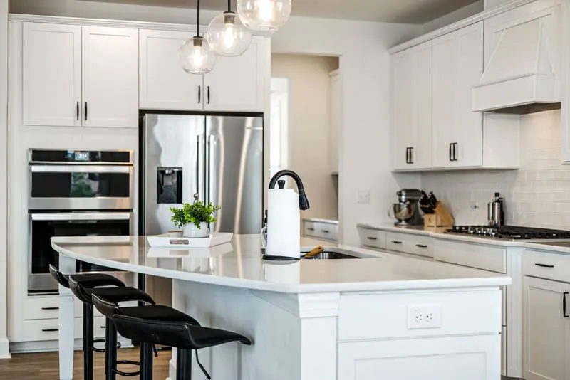 Sleek clean modern kitchen with white cabinets