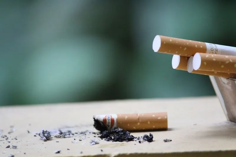 Cigarette butt and ash, tobacco smoke residue
