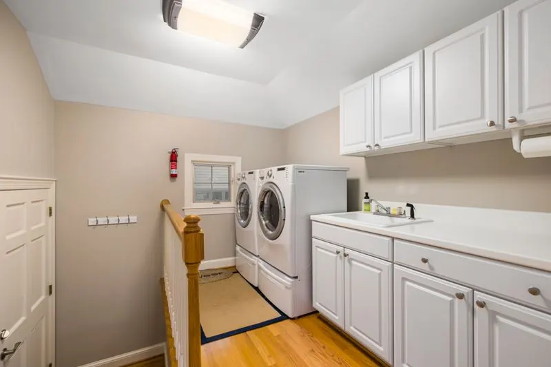 Clean residential utility room, basement laundry area